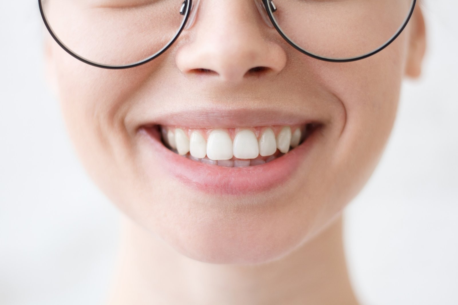 Cute girl showing her awesome joyful smile and white teeth